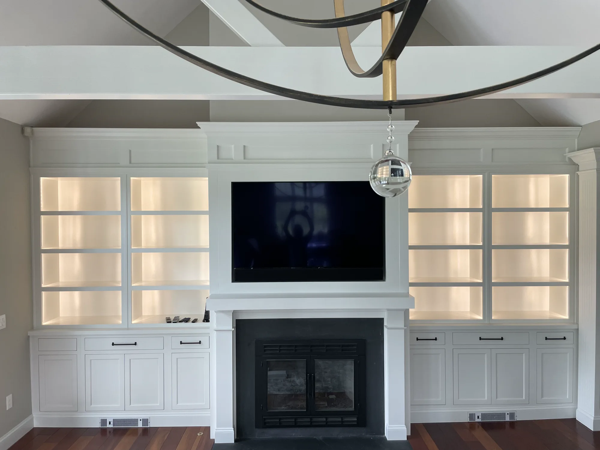 Custom built-in entertainment center and media wall with concealed storage by Mac Kitchens in the Lehigh Valley