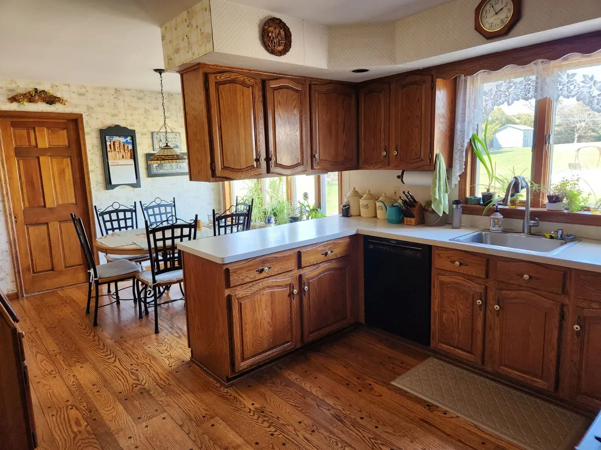 From oak and wallpaper to sage and stone — before Mac Kitchens' remodel