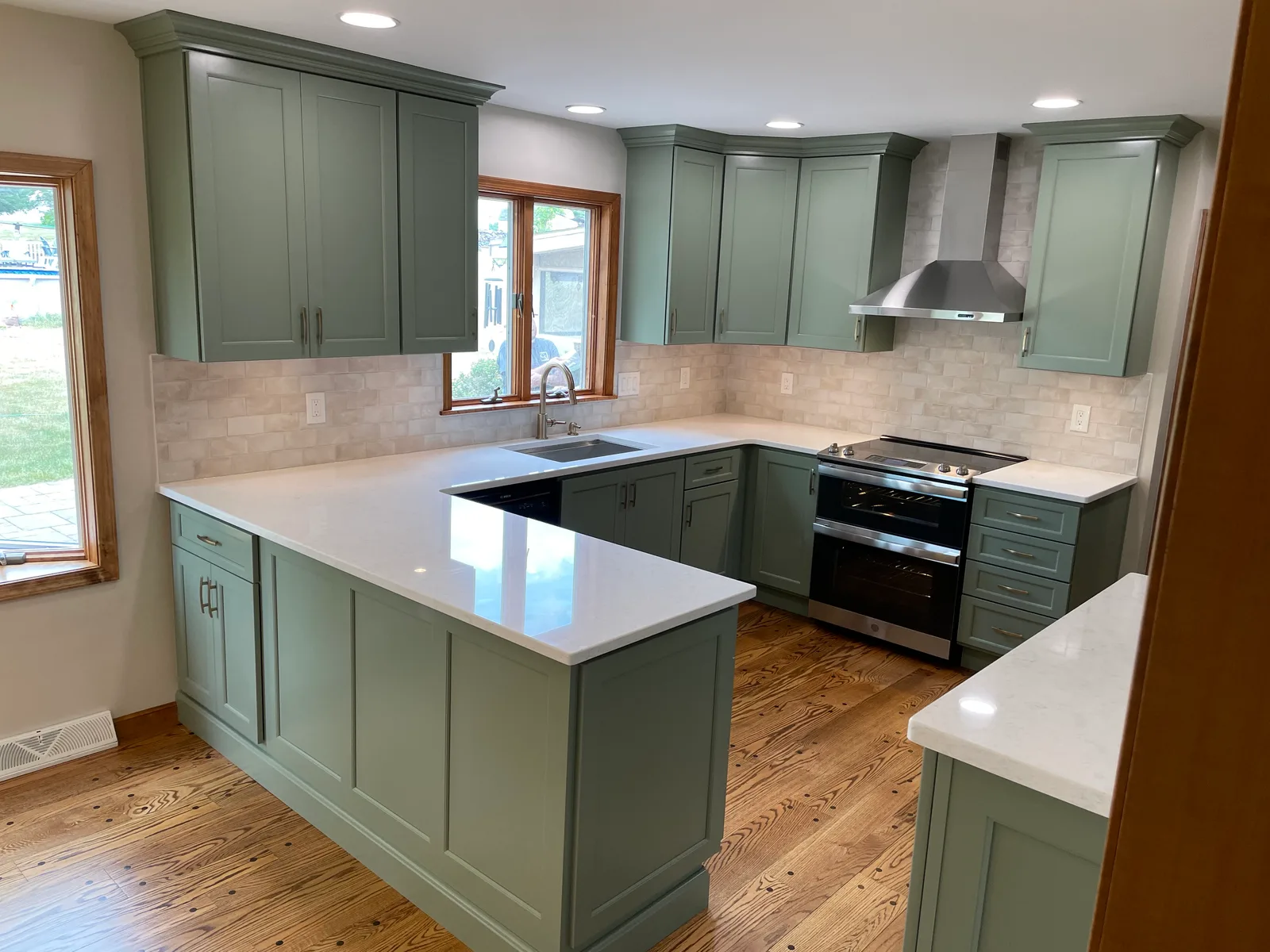 From oak and wallpaper to sage and stone — the finished result by Mac Kitchens